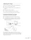 Page 35Projecting35
Adjusting the Image
Once you see your image, you need to make certain adjustments:    
■To focus or zoom your image, see below. 
■If the image is too high or too low, you can reposition it. See 
page 36.
■If the image isn’t square, see page 37.
■If a computer image displays incorrectly, see page 38. 
If you need to fine-tune the image and/or sound, see Chapter 4.
Focusing and Zooming Your Image
Open the lens access door, then do the following:
■Use the Focus ring on the projector to sharpen...