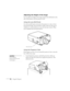 Page 5246Using the Projector
Adjusting the Height of the Image
You can adjust the height of the image using the lens shift knob on the 
side of the projector and the projector’s feet.
Using the Lens Shift Knob
Use the lens shift knob on the side of the projector to raise or lower 
the projected image. Press the knob to make it pop out; then turn it 
clockwise or counterclockwise to move the lens up or down. When 
you’re finished, press the knob back in.
Using the Projector’s Feet
If the image is too low, you...