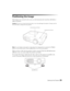 Page 25Setting Up the Projector25
Positioning the Image
If the image is not centered on the screen, use the horizontal and vertical lens shift dials to 
adjust its position.
Caution: Do not try to move the lens by hand, or you may damage the projector. Always use the 
lens shift dials to change the lens position.
Note: You can display a test pattern to help adjust the image position by pressing the Pattern 
button on the remote control. Press the Esc button to turn off the test pattern.
When you hear a click,...