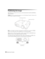 Page 2424Setting Up the Projector
Positioning the Image
If the image is not centered on the screen, use the horizontal and vertical lens shift dials to 
adjust its position.
Caution: Do not try to move the lens by hand, or you may damage the projector. Always use the 
lens shift dials to change the lens position.
Note: You can display a test pattern to help adjust the image position by pressing the Pattern 
button on the remote control. Press the Esc button to turn off the test pattern.
When you hear a click,...