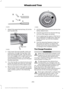 Page 2961.
Attach the spare tire lock key (A) to the
jack handle (B). 2. Fully insert the jack handle (with one
extension) through the bumper hole
and into the guide tube. The key and
lock will engage with a slight push and
counterclockwise turn. You will feel
some resistance when you turn the jack
handle assembly.
3. Turn the handle counterclockwise and
lower the spare tire until you can slide
the tire rearward and the cable is slack.
4. Remove the retainer through the center
of the wheel. If your vehicle is...