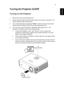 Page 199
EnglishTurning the Projector On/Off
Turning on the Projector
1 Remove the lens cap.(Illustration #1)
2 Ensure that the power cord and signal cable are securely connected.  The 
Power indicator LED will flash red.
3 Turn on the projector by pressing Power button on the control panel, 
and the Power indicator LED will turn blue.(Illustration #2)
4 Turn on your source (computer, notebook, video player ,etc.).  The 
projector will detect your source automatically.
• If the screen displays Lock and Source...