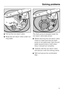 Page 51^Pull out the non-return valve.
^Rinse the non-return valve under run-
ning water.The drain pump is situated under the
non-return valve (see arrow).
^Before returning the non-return valve,
check to make sure that the drain
pump is not obstructed. Spin the pro-
peller several times in both direc-
tions; it should turn smoothly.
^Carefully refit the non-return valve
and secure it with the locking clamp.
^Refit and secure the combination
filter.
Solving problems
51 